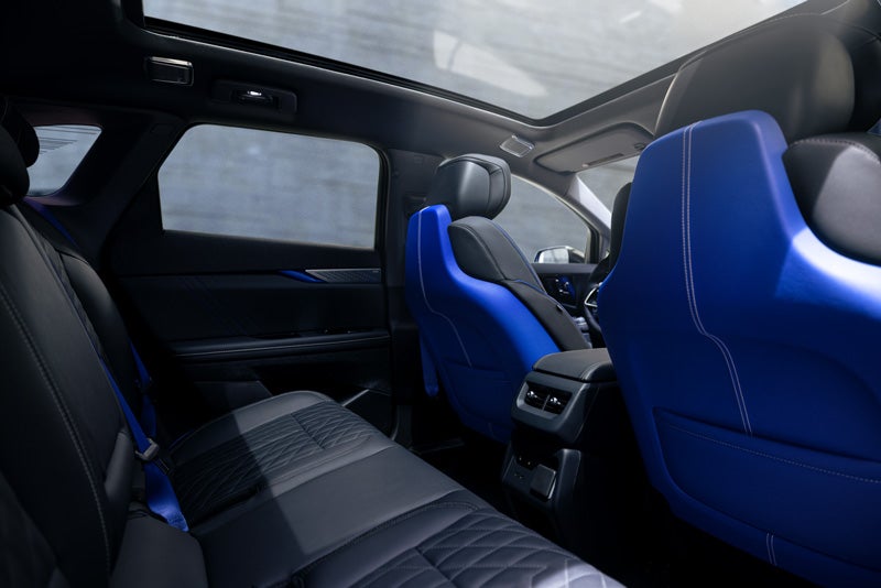 Back Seat View of the 2026 OPTIQ-V Blue Front Seats, Sun Roof, and Interior | Dellenbach Cadillac in FORT COLLINS CO